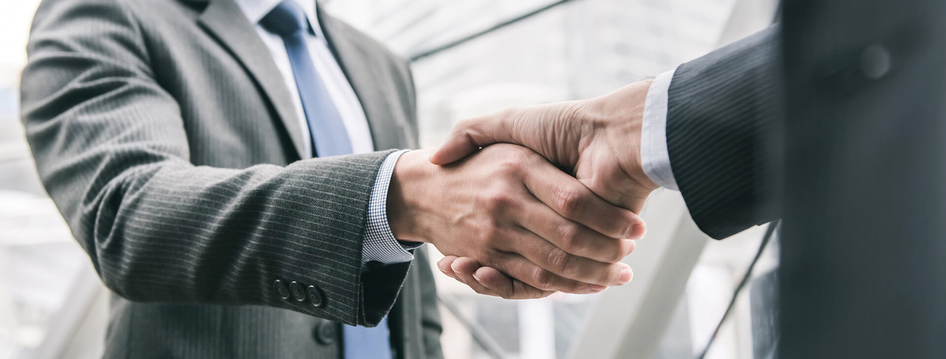 businessman-making-handshake-with-partner-t